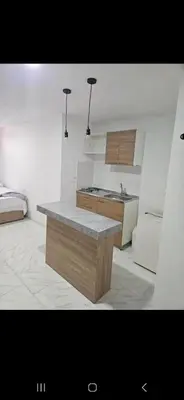 a kitchen with a island in the middle of a room at Vacacional amoblado Doradal 302 in Doradal