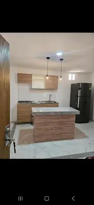 a kitchen with a counter top and a refrigerator at Vacacional amoblado Doradal 302 in Doradal