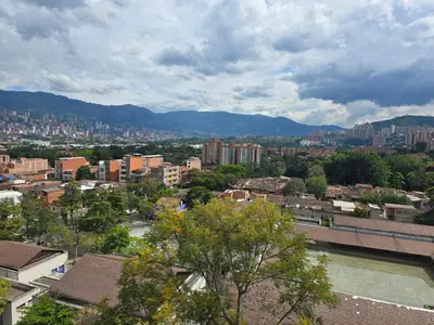 a view of a city with buildings and a river at Amoblado Belen Avenida in Medellín