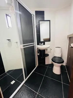 a bathroom with a toilet and a sink at Acogedora casa en el carmen de Viboral in Carmen de Viboral