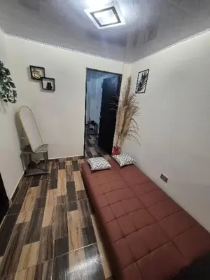 a hallway with a red couch in a room at Medellín urban refuge in Medellín