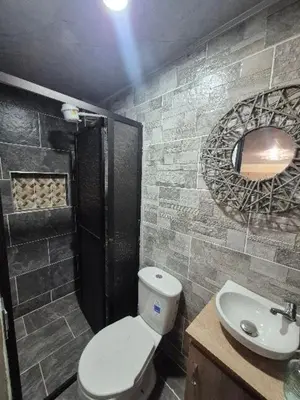 a bathroom with a toilet and a sink at Medellín urban refuge in Medellín