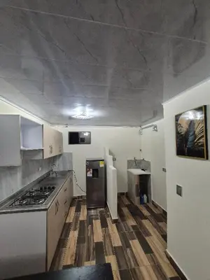 a kitchen with a stove top oven in a room at Medellín urban refuge in Medellín