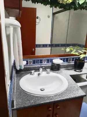 a bathroom counter with a sink and a mirror at Aldea Gloria, dúplex, familiar & Pets en Laureles in Medellín