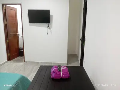 a pink purse sitting on a table in a room at Alojamientos Jamar in Rionegro