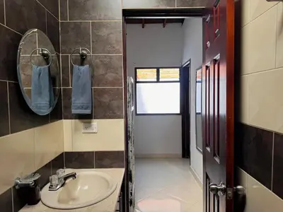 a bathroom with a sink and a mirror at Apartamento Espacioso Belen Alameda cerca a Laureles y unidad deportiva de Belen in Medellín
