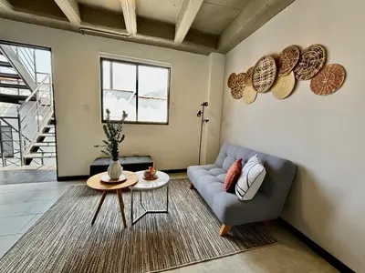 a living room with a couch and a table at Apartamentos Virginia 34 in Medellín