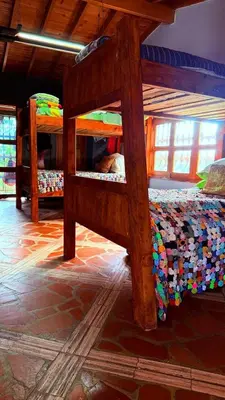 a bedroom with two bunk beds in a room at Casa Finca Cerca a Medellin y Aeropuerto JMC in Guarne
