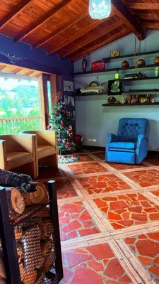 a living room with a christmas tree and a couch at Casa Finca Cerca a Medellin y Aeropuerto JMC in Guarne