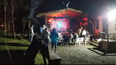 a group of people standing in front of a stage at Casa Finca Cerca a Medellin y Aeropuerto JMC in Guarne