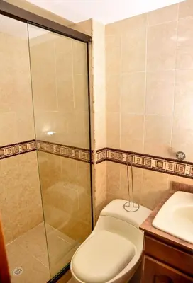 a bathroom with a shower and a toilet and a sink at Your Mountain View Retreat in Medellín in Medellín