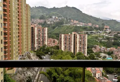 a view from a balcony of a city with buildings at Your Mountain View Retreat in Medellín in Medellín