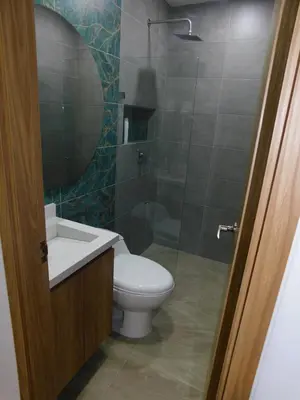 a bathroom with a toilet and a sink and a shower at Apartasol vacacional con Piscinas en Santa Fe de Antioquia in Santa Fe de Antioquia