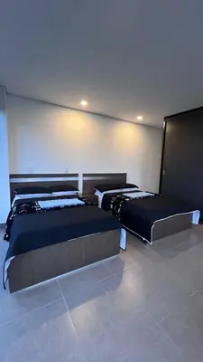 a bedroom with two beds in a room at Villa Salomé in Guatapé in La Pradera