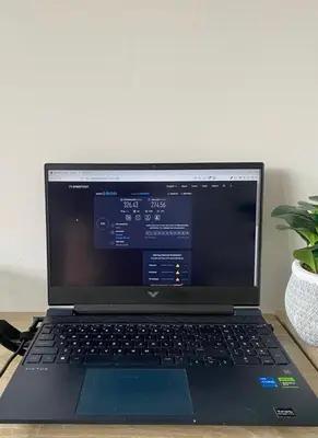 a laptop computer sitting on top of a desk at Art, design and urban life in Medellín loft in Medellín