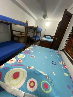 a bedroom with a bed with a colorful comforter at Casa Bora Bora in Sopetran