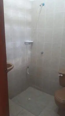 a bathroom with a shower with a toilet and a sink at Casa Bora Bora in Sopetran