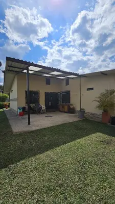 a house with a patio with a roof at Casa campestre tranquila cerca de termales in Santa Rosa de Cabal