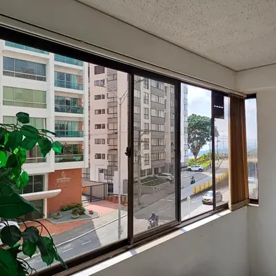 a window in a room with a view of a street at Quédate En El Punto Más Central De Manizales in Manizales