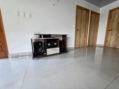 a living room with two speakers and a tv at Finca La Rosa in Ebéjico
