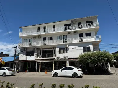 a white car parked in front of a building at 5ta HOTEL CONTINENTAL in Puerto Boyacá