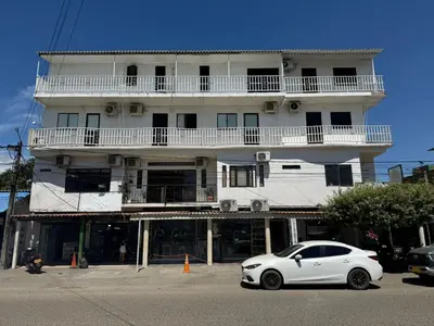 a white car parked in front of a building at 5ta HOTEL CONTINENTAL in Puerto Boyacá