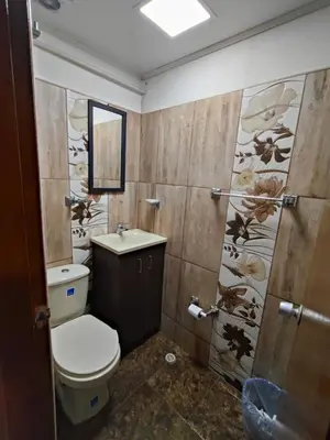 a bathroom with a toilet and a sink and a shower at Kumho in Medellín
