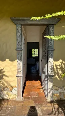 an open door to a bedroom with a bed in it at Hacienda La Tranquera in Anserma