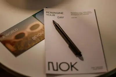 a pen is sitting on top of a book at NOK Peaceful 3BR in Medellin in Medellín