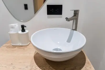 a white bowl sink on a counter in a bathroom at Fresco Living in Medellín