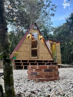 a small house with a door in the middle at Almonte Glamping in Guarne