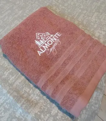 a red rug with writing on it on the floor at Almonte Glamping in Guarne