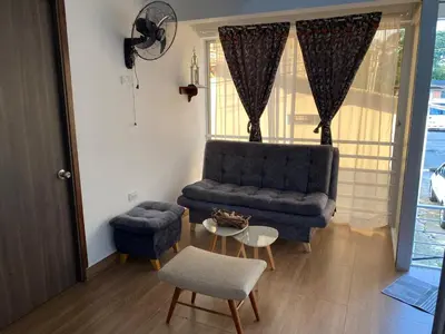a living room with a couch and a table at La Casa de Oliva in Norcasia