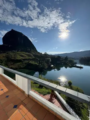 a view of a lake from a balcony at Casa Finca en Guatapé in Guatapé
