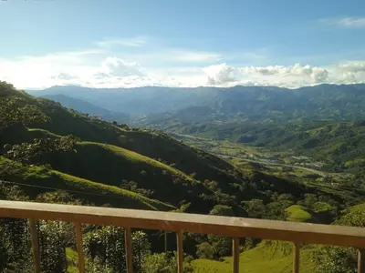 a view of the mountains from the balcony of a house at Balcones de la montaña in El Limón