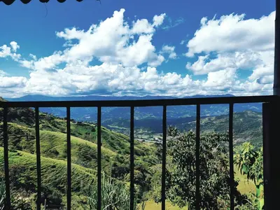 a view of the hills from a balcony of a house at Balcones de la montaña in El Limón