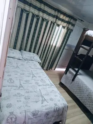 a bedroom with a bed with writing on it at Balcones de la montaña in El Limón
