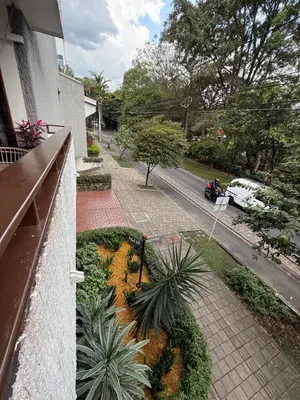 a view of a street from a balcony of a house at Hotel Balcones De Malibu in Medellín