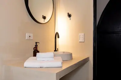 a bathroom with a sink and a mirror at Hotel Boutique Casamía in Medellín