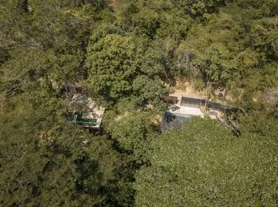 an overhead view of a house in the forest at Cabaña El Mamoncillo - Jacuzzi Privado con Calefacción y Malla Catamarán - Cerca a Medellín in Sopetran