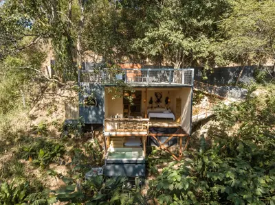a house in the middle of a forest at Cabaña El Mamoncillo - Jacuzzi Privado con Calefacción y Malla Catamarán - Cerca a Medellín in Sopetran