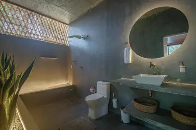 a bathroom with a sink and a toilet and a mirror at Cabaña El Bosque - En medio del bosque - Jacuzzi Privado con Calefacción y Malla Catamarán - Cerca a Medellin in Sopetran