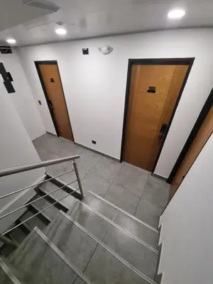 an empty room with two doors and a staircase at Andes Coliving in Estación El Salto