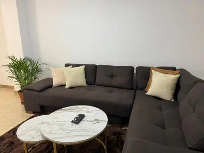 a living room with a couch and a table at Apartamento en Laureles- Avenida Nutibara in Medellín