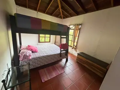 a bedroom with a large bed in a room at El Paraíso Tropical in La Pradera