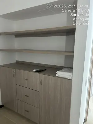 a wooden cabinet in a room with a shelf at Hermoso Apartasol en Santa Fe de Antioquia!!! in Santa Fe de Antioquia