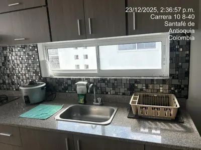 a kitchen counter with a sink and a window at Hermoso Apartasol en Santa Fe de Antioquia!!! in Santa Fe de Antioquia