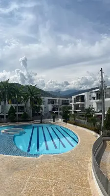 a large swimming pool in front of a building at Hermoso Apartasol en Santa Fe de Antioquia!!! in Santa Fe de Antioquia