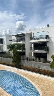 a building with a swimming pool in front of it at Hermoso Apartasol en Santa Fe de Antioquia!!! in Santa Fe de Antioquia