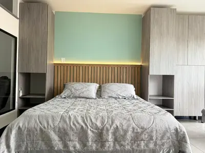 a bedroom with a large bed with two pillows at Cozy Studio 703 Heart of Laureles in Medellín
